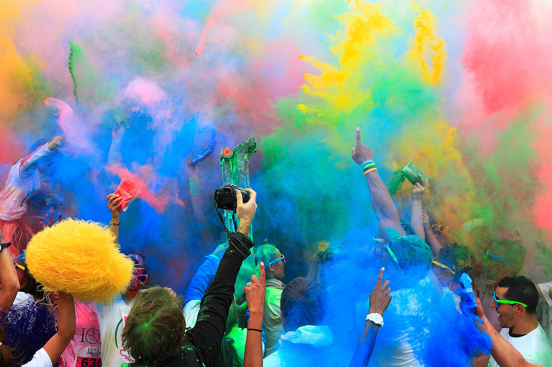 France, Northern France, Calais, Holi Run: a race where the participants wear white outfits when they start and end up covered in coloured powder.