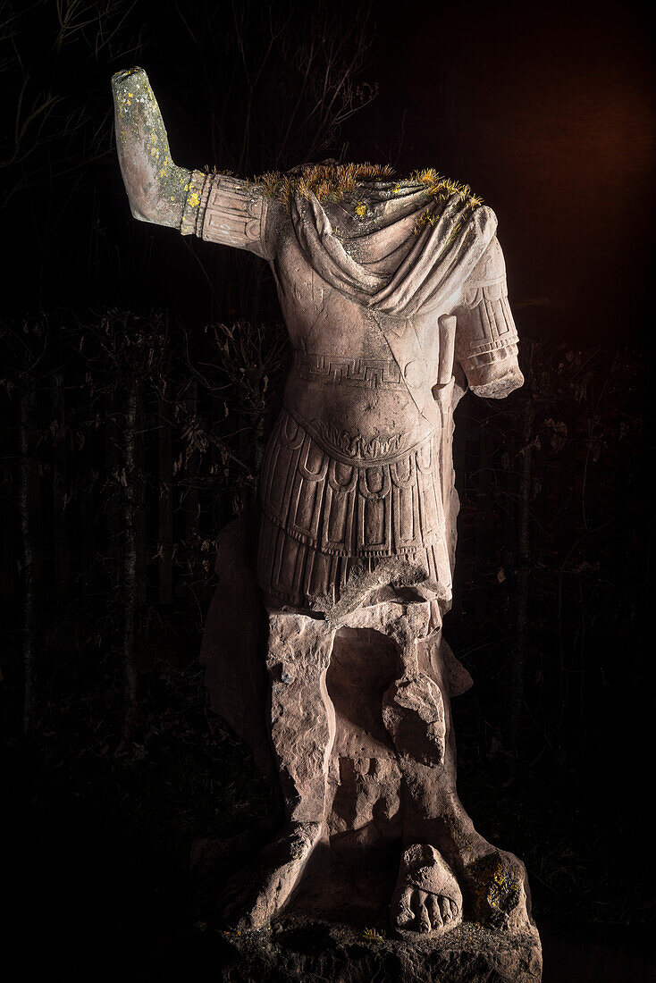 UNESCO World Heritage Limes roman border, Illuminated roman statue at fort in Aalen, Limes Museum in Aalen, Ostalb province, Baden-Wuerttemberg, Germany