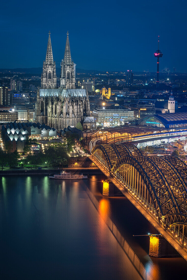 UNESCO World Heritage Cologne cathedral at dusk, Hohenzollern Bridge across Rhine River, Cologne, North Rhine-Westphalia, Germany