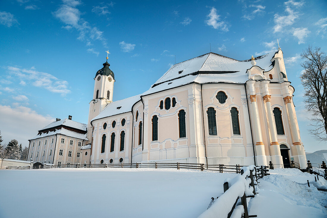 UNESCO World Heritage Wies Church, pilgrimage church surrounded by snow, Steingaden, Bavaria, Germany