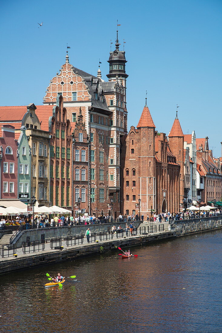 Kayak on Mot?awa river with old town buildings, Gdansk, Pomerania, Poland