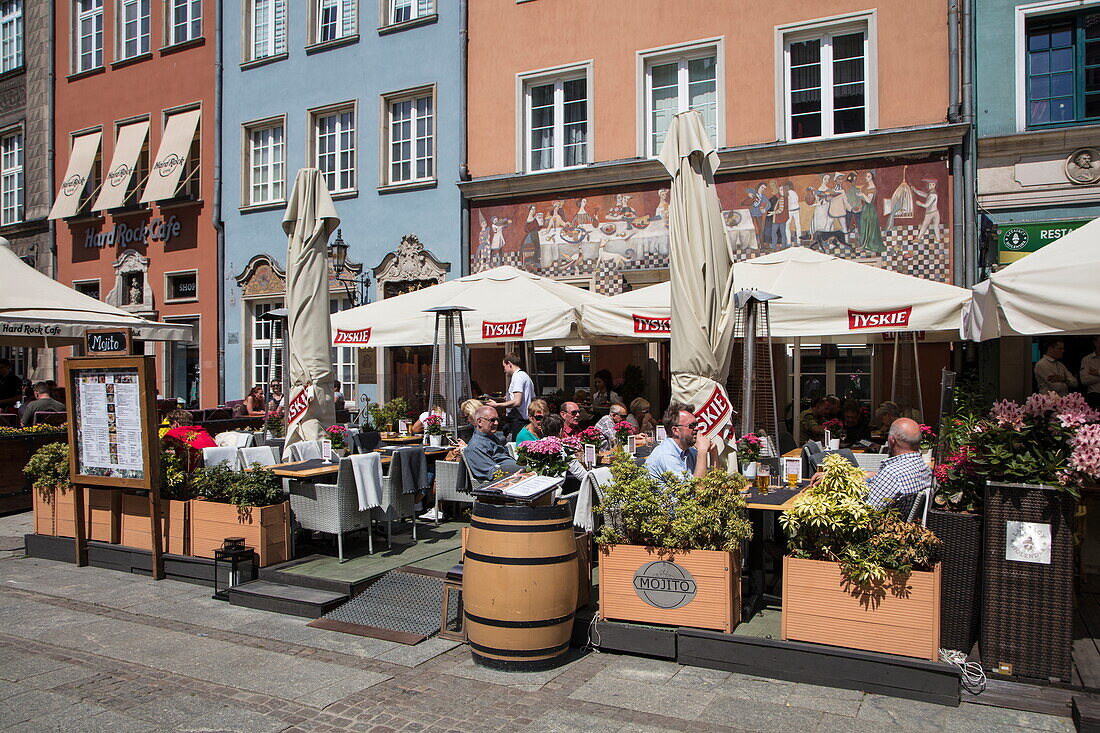 People sit outside at restaurant in Old Town, Gdansk, Pomerania, Poland
