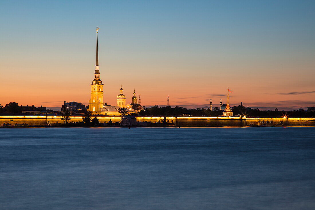 'Neva river with illuminated Peter and Paul Cathedral in Peter and Paul Fortress during ''White Nights'' at dusk, St. Petersburg, Russia'