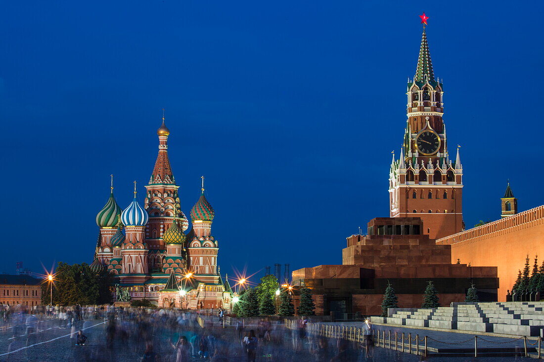 Illuminated Lenin Mausoleum, Moscow Kremlin wall and St. Basil's Cathedral in Red Square at dusk, Moscow, Russia