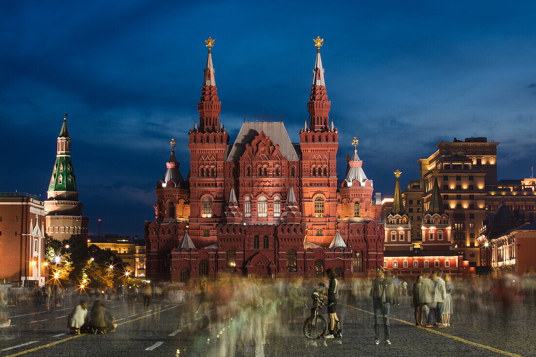 Illuminated Moscow Kremlin wall and State Historical Museum in Red Square at dusk, Moscow, Russia