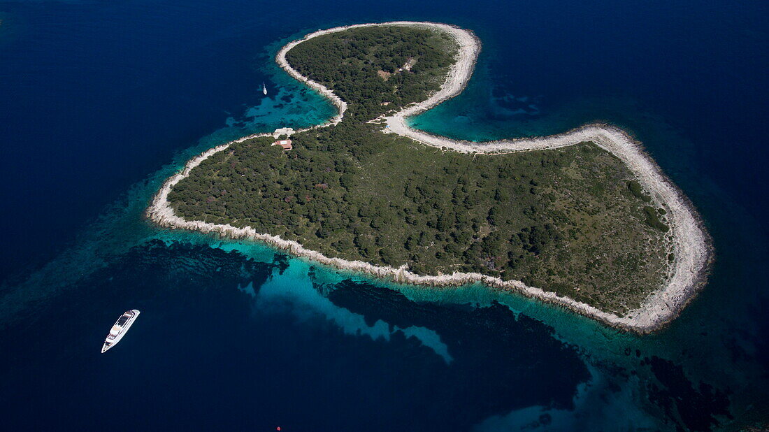 Aerial of cruise ship MS Romantic Star (Reisebüro Mittelthurgau) and island in Adriatic Sea, near Hvar, Split-Dalmatia, Croatia