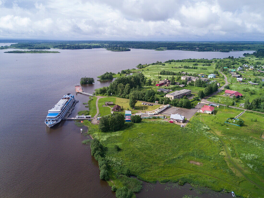 Aerial of river cruise ship Excellence Katharina of Reisebüro Mittelthurgau (formerly MS General Lavrinenkov) at pier, Goritsy, Sheksna river, Russia