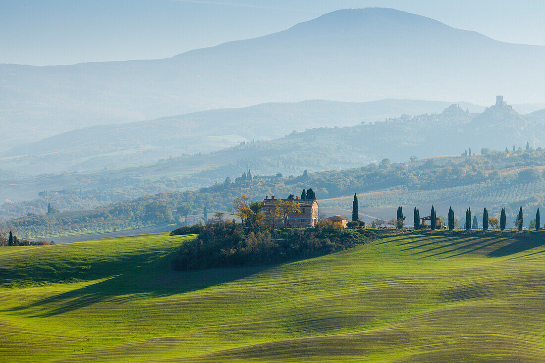 View to Monte Amiata and castle tower of Castiglione d Orcia, cottage, cypresses, near S. Quirico d´Orcia, Val d´Orcia, UNESCO World Heritage Site, Tuscany, Italy, Europe