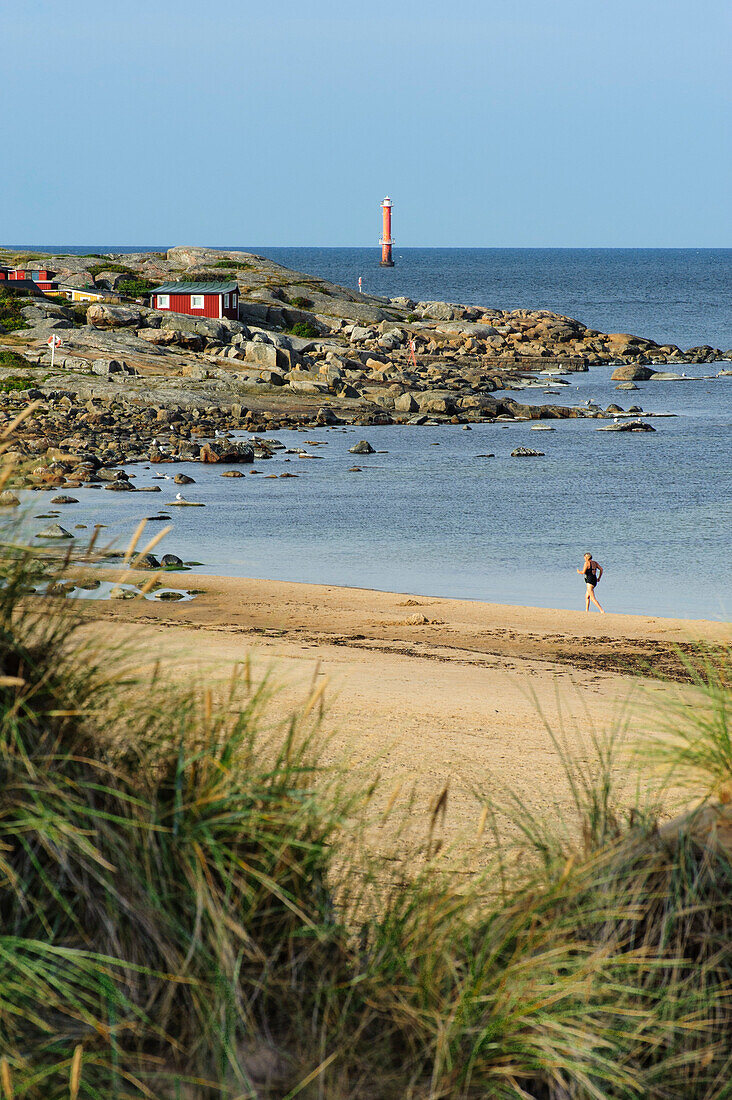 Walkers on the beach at Tyloesand, Sweden