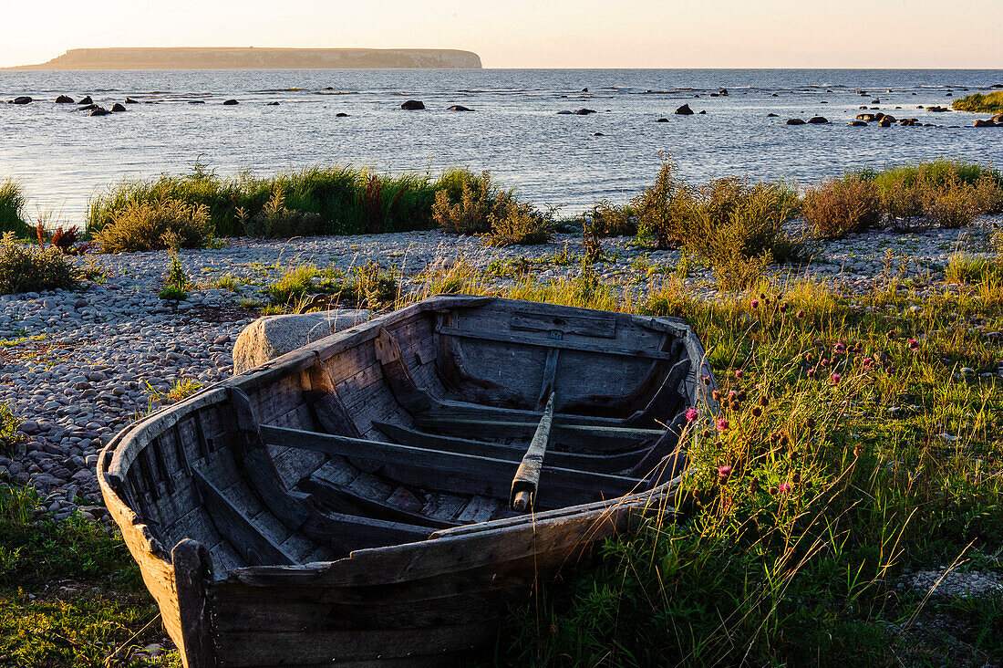 Old wooden boat on the beach in nature reserve Ekstakusten, Schweden