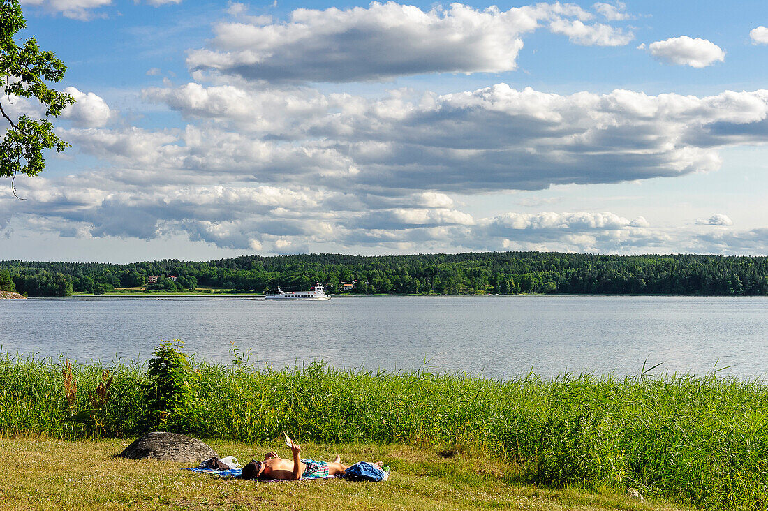 Sunbathing at the Maelarsee near Mariefred, Sweden