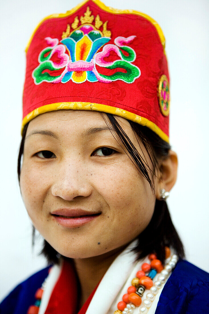 Asian woman wearing a traditional hat