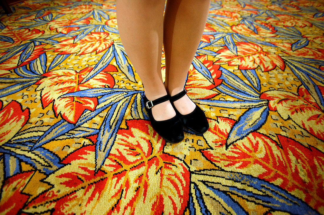 Woman wearing shoes on carpet of leaves