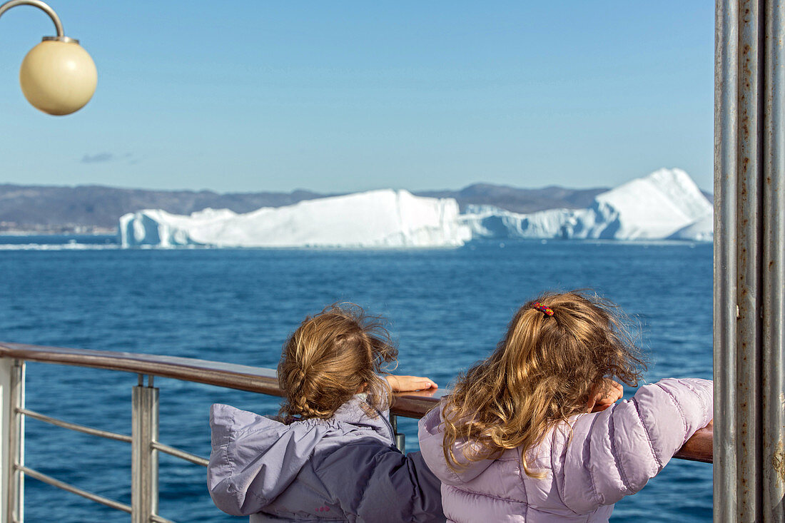 young girls, passengers aboard the astoria, discovery of the ice fjord, jakobshavn glacier, 65 kilometres long, coming from the inlandsis, sermeq kujalleq, ilulissat, greenland