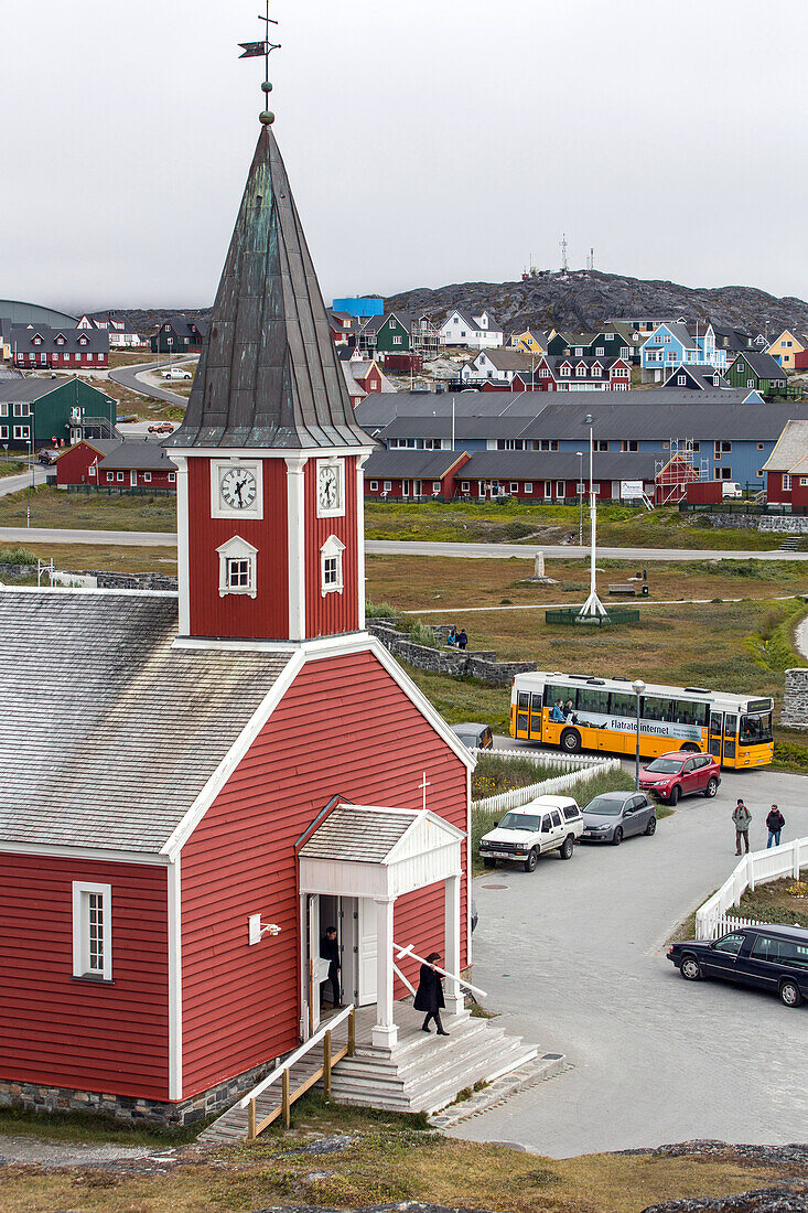 people leaving a funeral mass, wooden church of the city of nuuk, capital of greenland
