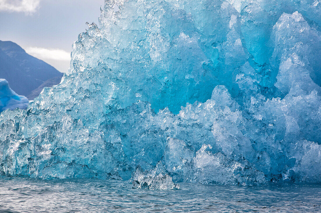 icebergs that separated from the glacier snouts, strangely shaped block of blue ice, fjord of narsaq bay, greenland