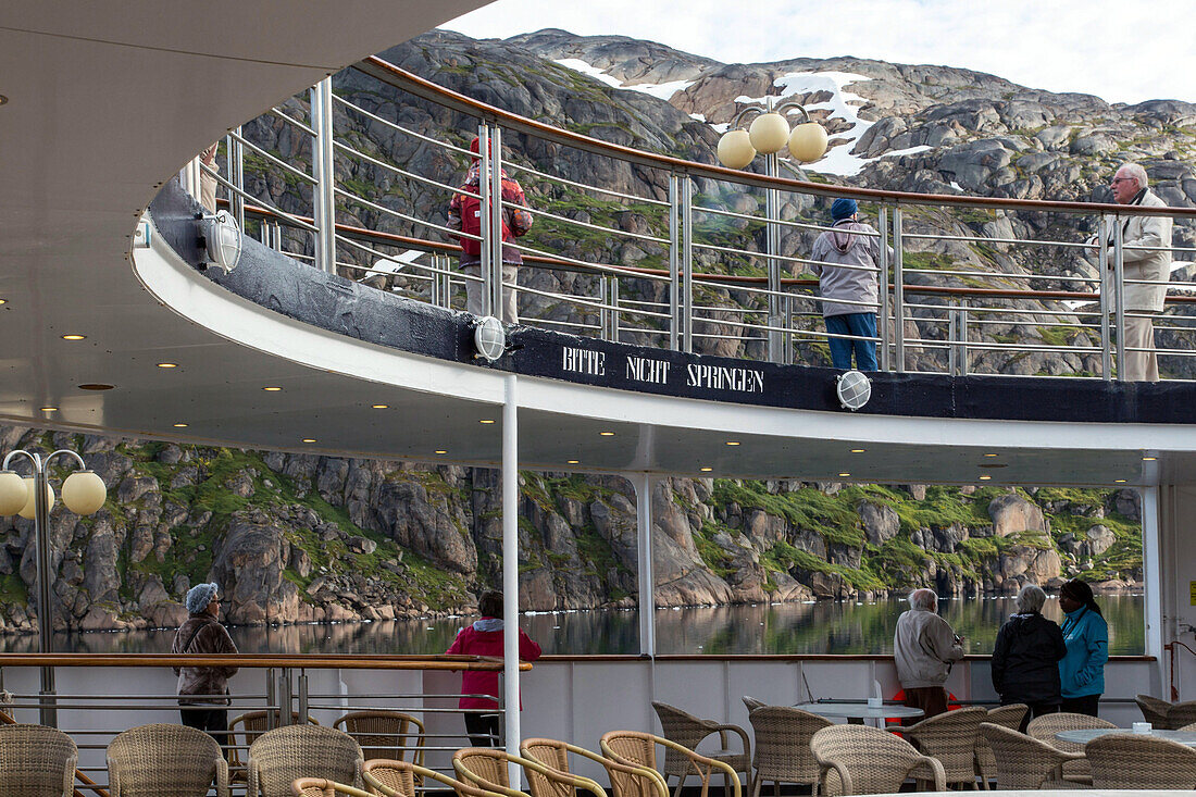 passengers on the ocean liner's deck to admire the landscape, astoria cruise ship, fjord in the prince christian sound, greenland