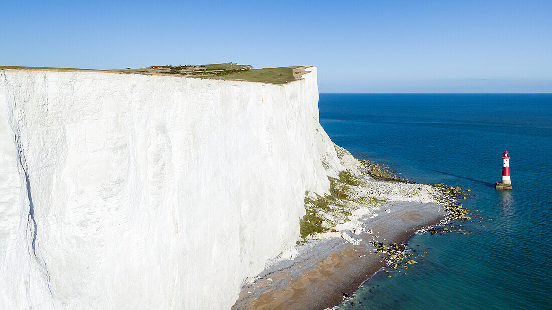 White chalk cliffs of Beachy Head and lighthouse, South Downs National Park, near Eastbourne, East Sussex, England, United Kingdom, Europe