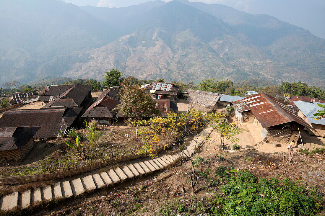 Recently constructed concrete steps to ease access between higher and lower sections of village on steep Naga hillside, Nagaland, India, Asia