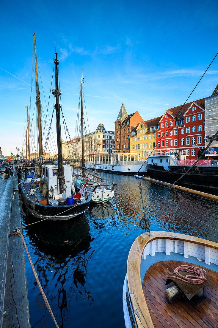 Boats in Christianshavn Canal with typical colourful houses in the background, Copenhagen, Denmark, Europe