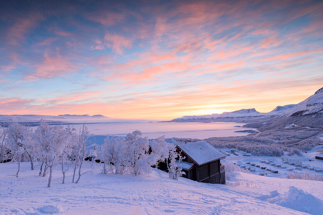 Pink sunrise on the snowy landscape, Bjorkliden, Abisko, Kiruna Municipality, Norrbotten County, Lapland, Sweden, Scandinavia, Europe