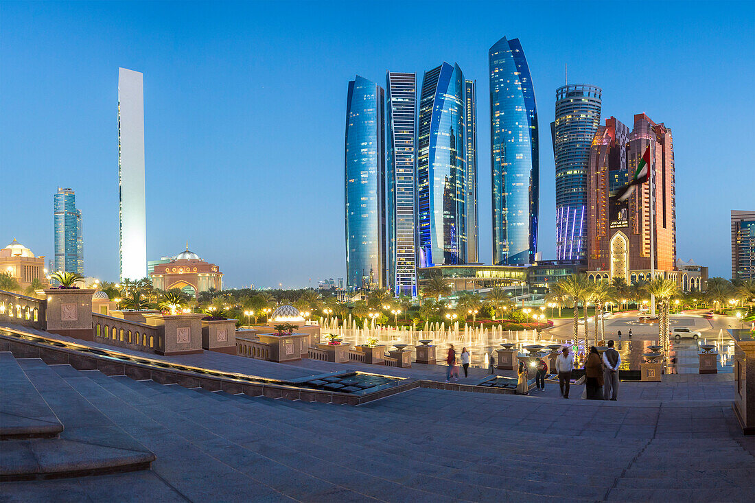 Etihad Towers viewed over the fountains of the Emirates Palace Hotel, Abu Dhabi, United Arab Emirates, Middle East