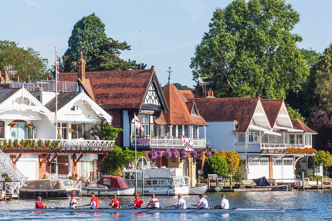 England,Oxfordshire,Henley-on-Thames,Boathouses and Rowers on River Thames