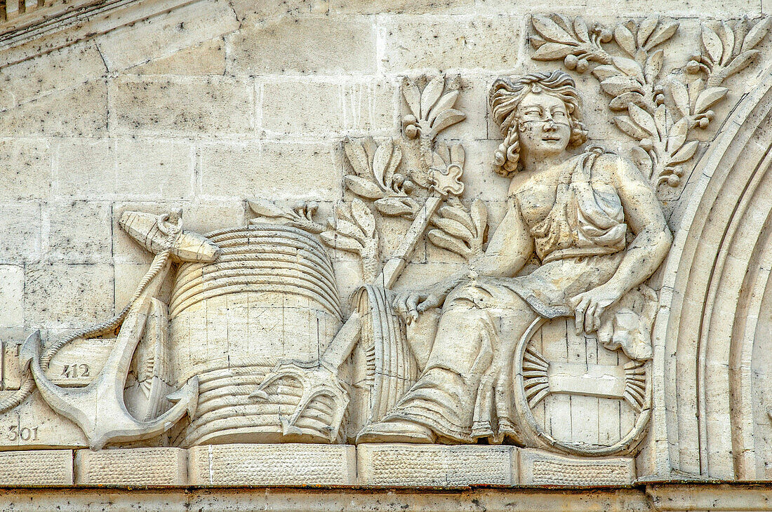 France, Gironde, Castillon-la-Bataille, allegorical bas-relief depicting the wine-producing craft on the front of a wine-warehouse