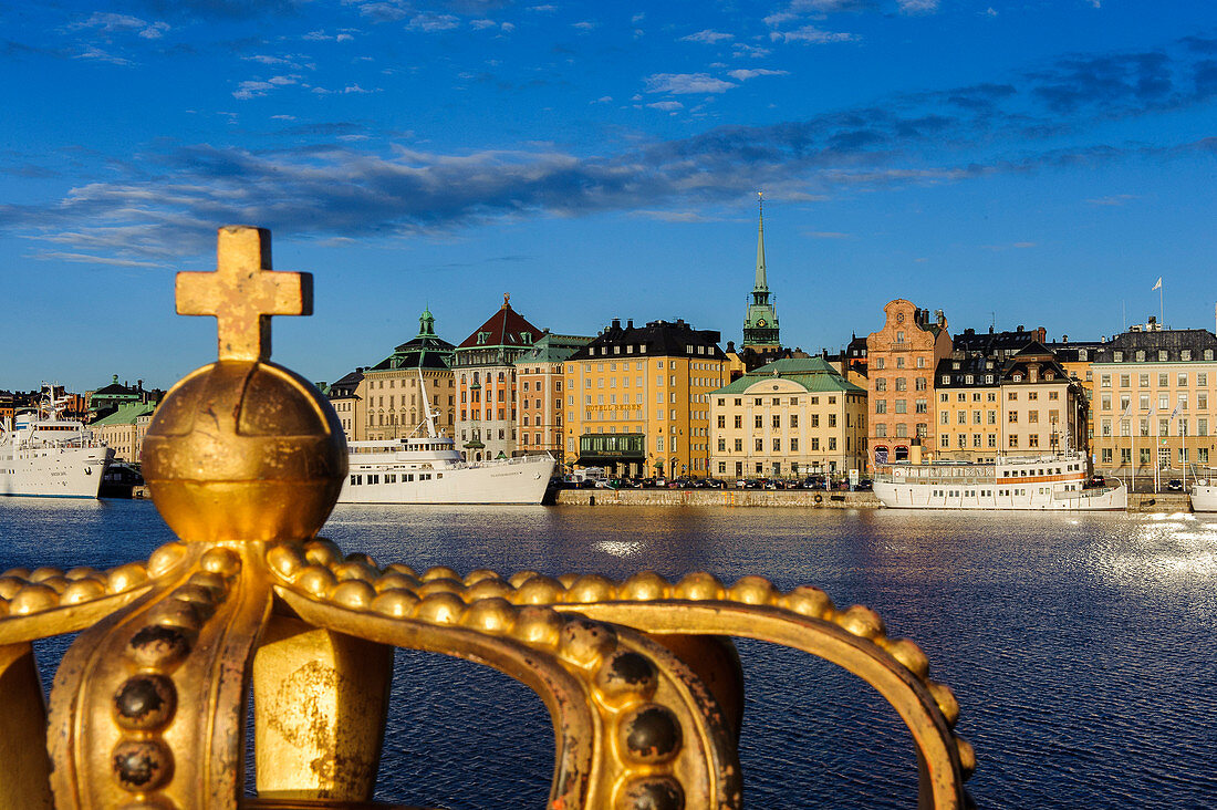 View from the Skeppsholmsbron with crown on the railing on the old town, Stockholm, Sweden