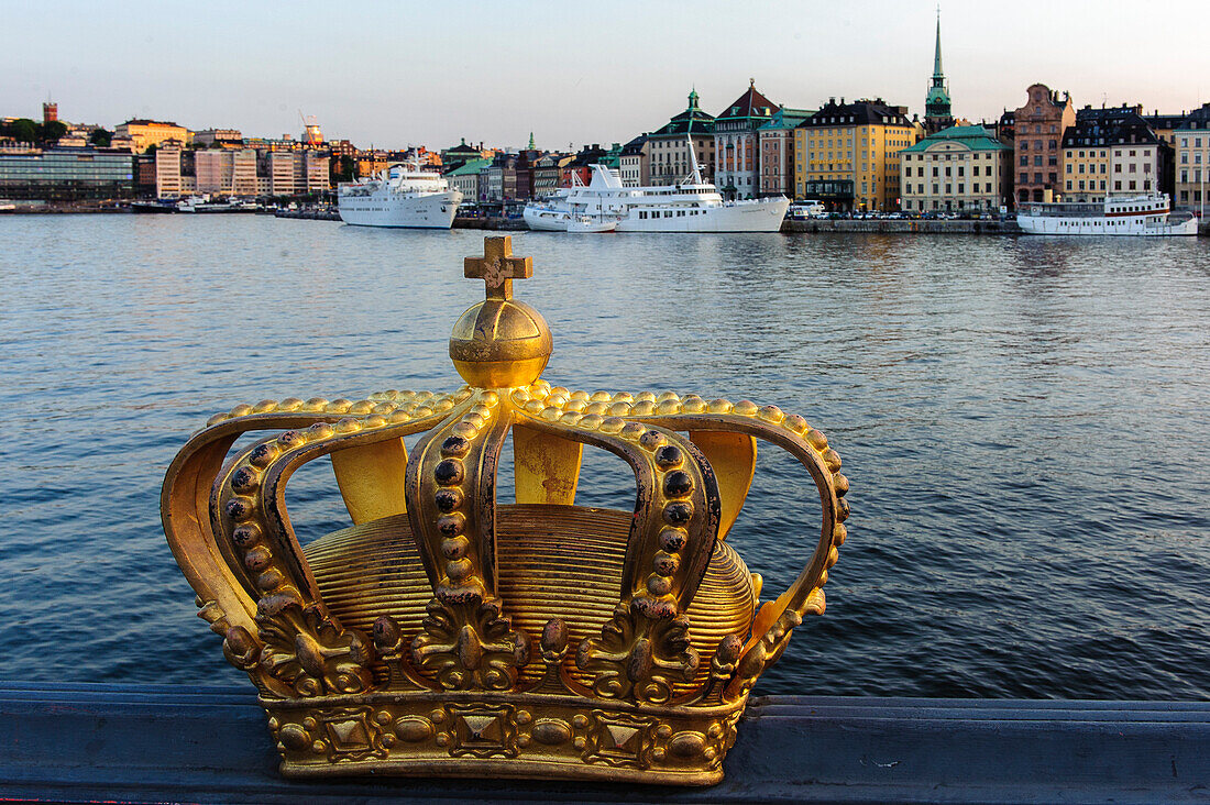 View from the Skeppsholmsbron with crown on the railing on the old town, Stockholm, Sweden