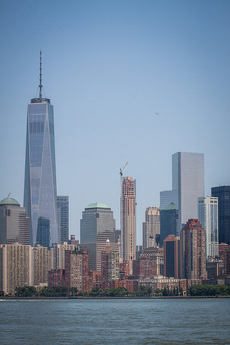 view of manhattan and one world trade center from ellis island, museum of immigration immigration, the new york financial district, new york city, state of new york, united states, usa