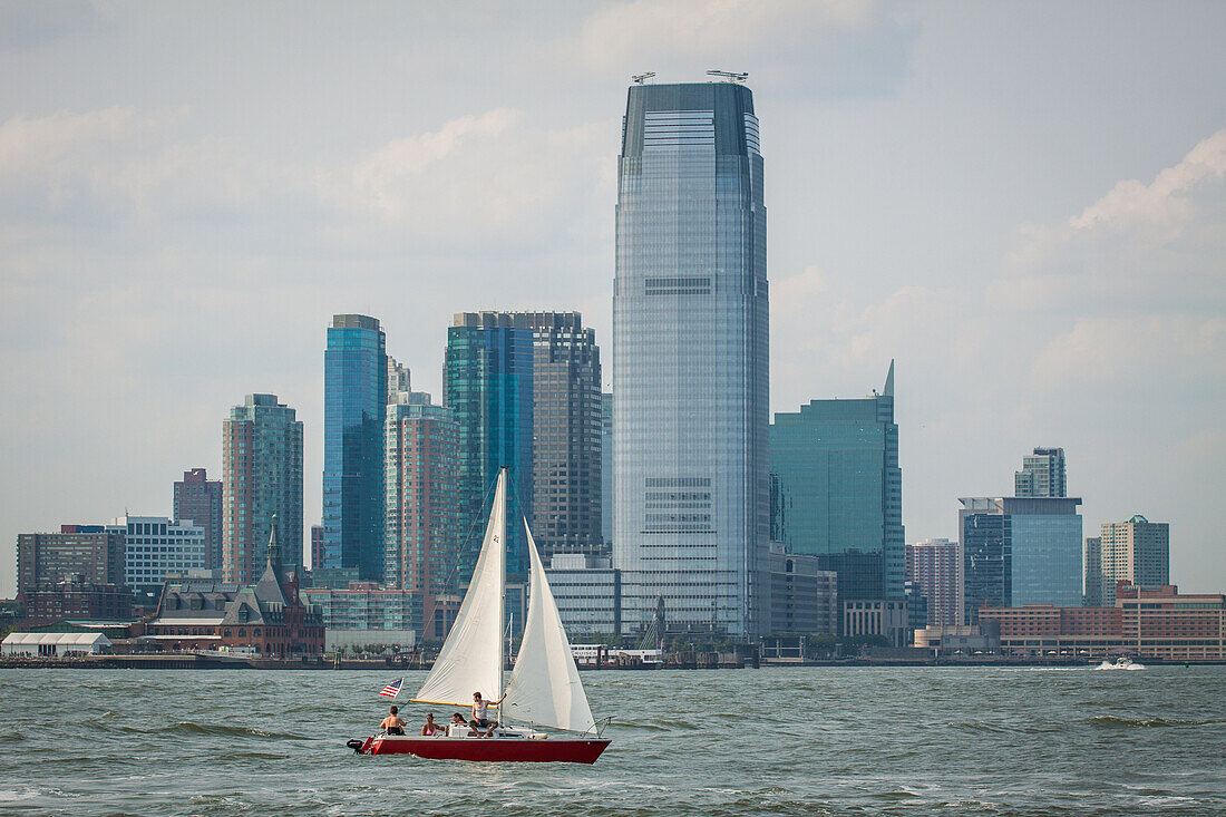 sailboat passing in front of jersey city with the goldman sachs tower in the background, headquarters of the american investment bank goldman sachs, jersey city, state of new jersey, united states, usa