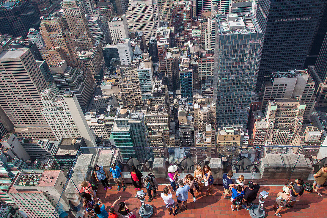 tourists contemplating the view of new york from the top of the rock observatory, manhattan, new york city, state of new york, united states, usa