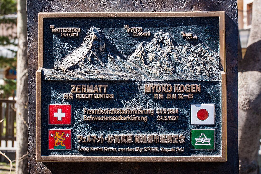 plaque commemorating the twinning of the matterhorn and myoko kogen in japan, village centre of zermatt, ski resort, zermatt, canton of valais, switzerland
