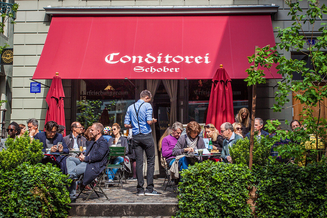 customers on the terrace of the famous teahouse schober in the old town of zurich, canton of zurich, switzerland