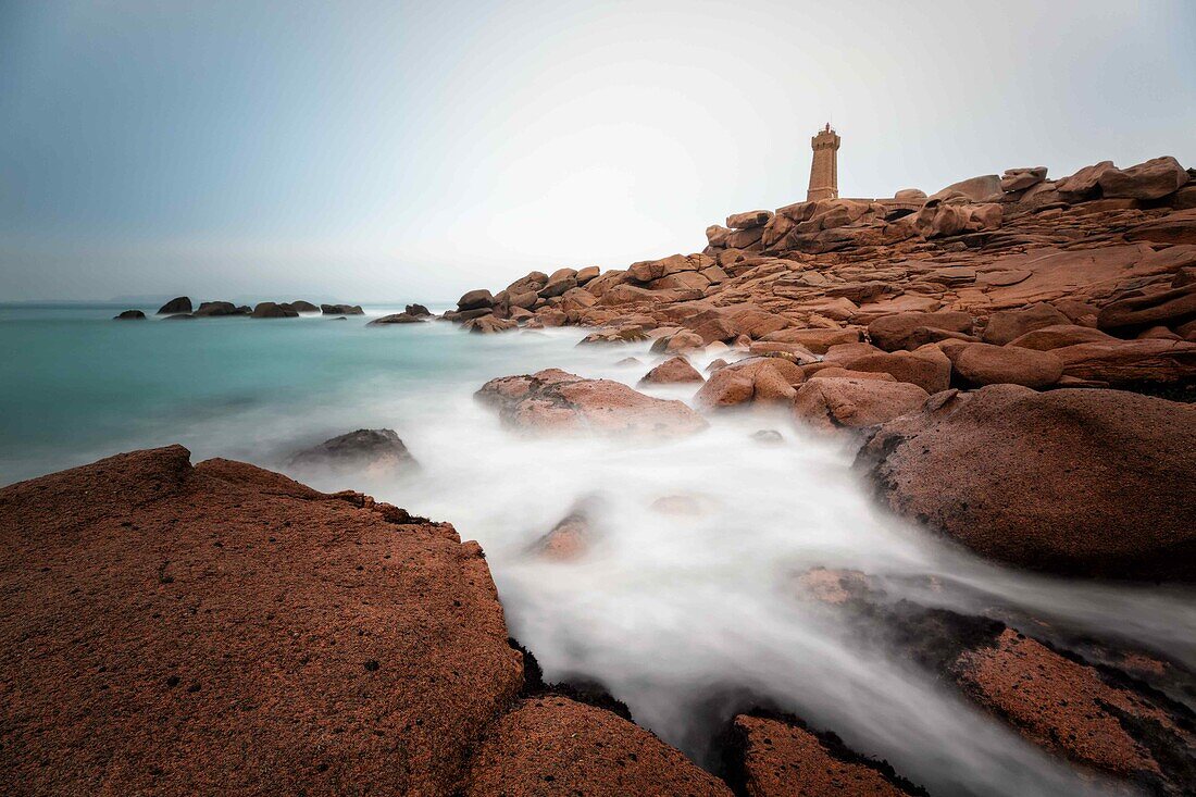 long exposure shot of the ploumanac'h lighthouse and the pink granite coast, perros-guirec, morlaix, finistere (29), brittany, france