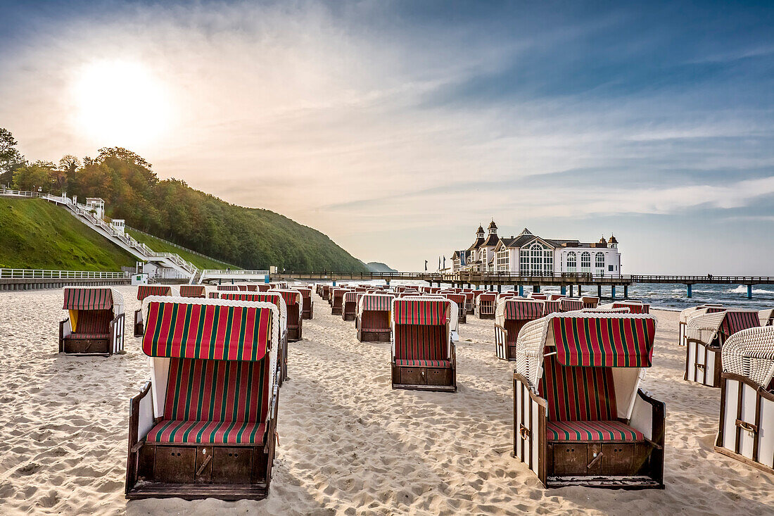 Sellin Pier and beach chairs in backlight, Sellin, Ruegen Island, Mecklenburg-Western Pomerania, Germany