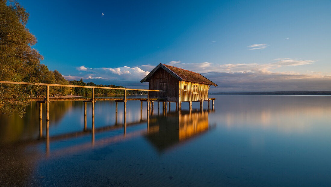 Warm light on a boathouse near Stegen at lake Ammersee, Bavaria, Germany