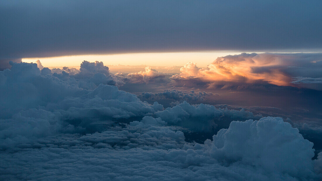 stormy atmosphere between the clouds in the evening, aerial, southern Germany
