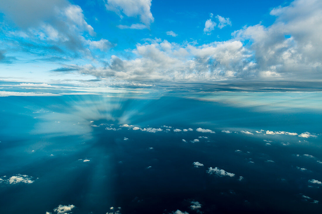 sunrays pierce through the clouds, aerial, Italy