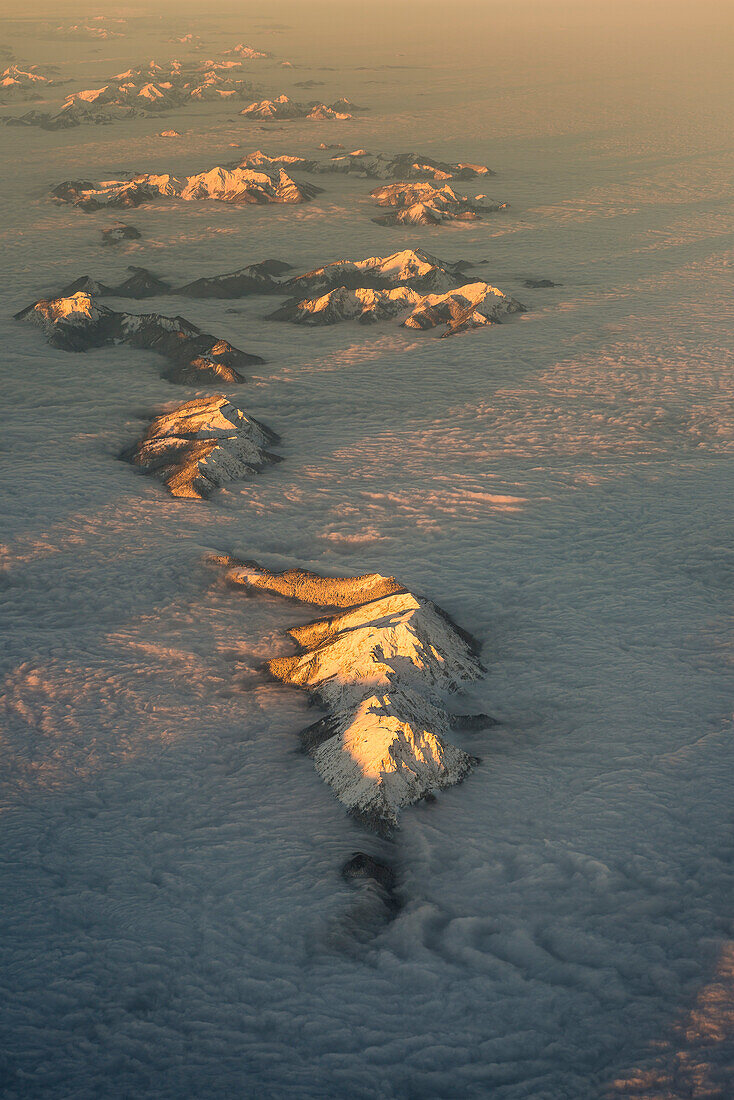 The mountains look like islands sticking out of a sea of clouds, aerial picture, Salzburg region, Austria