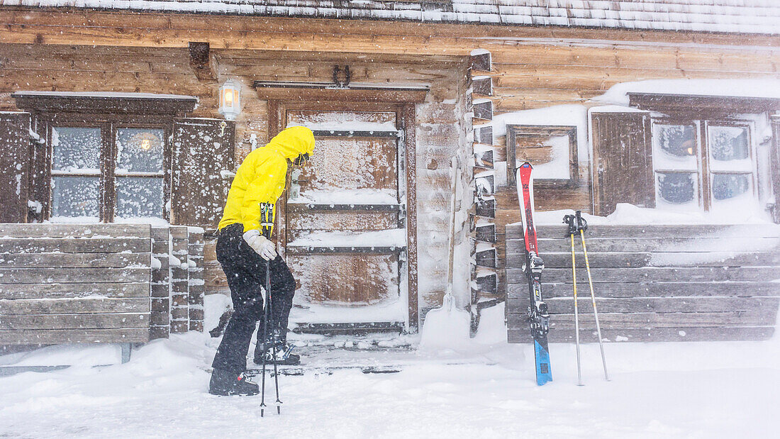 Germany, Bavaria, Alps, Oberallgaeu, Oberstdorf, Winter Holidays, Winter Sports, Relaxing in an alpine hut during a blizzard