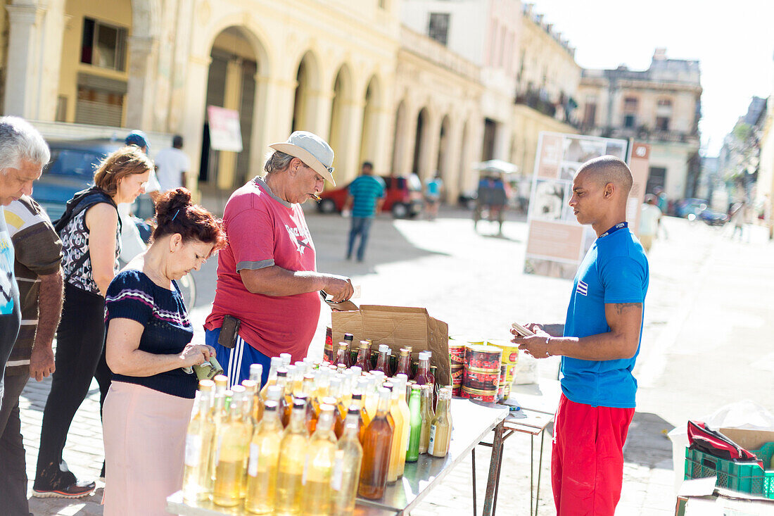 Shopping in Havana, vendor selling drinks with his street shop, historic town center, old town, Habana Vieja, family travel to Cuba, parental leave, holiday, time-out, adventure, MR, Havana, Cuba, Caribbean island