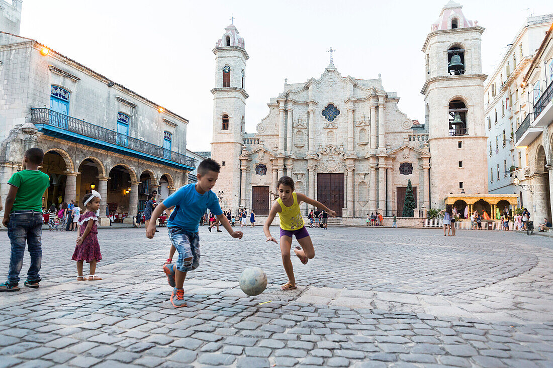 Cathedral at Havana Vieja, Plaza de la Cathedrale, children playing football on the square, historic town, center, old town, Habana Vieja,  family travel to Cuba, parental leave, holiday, time-out, adventure, Havana, Cuba, Caribbean island