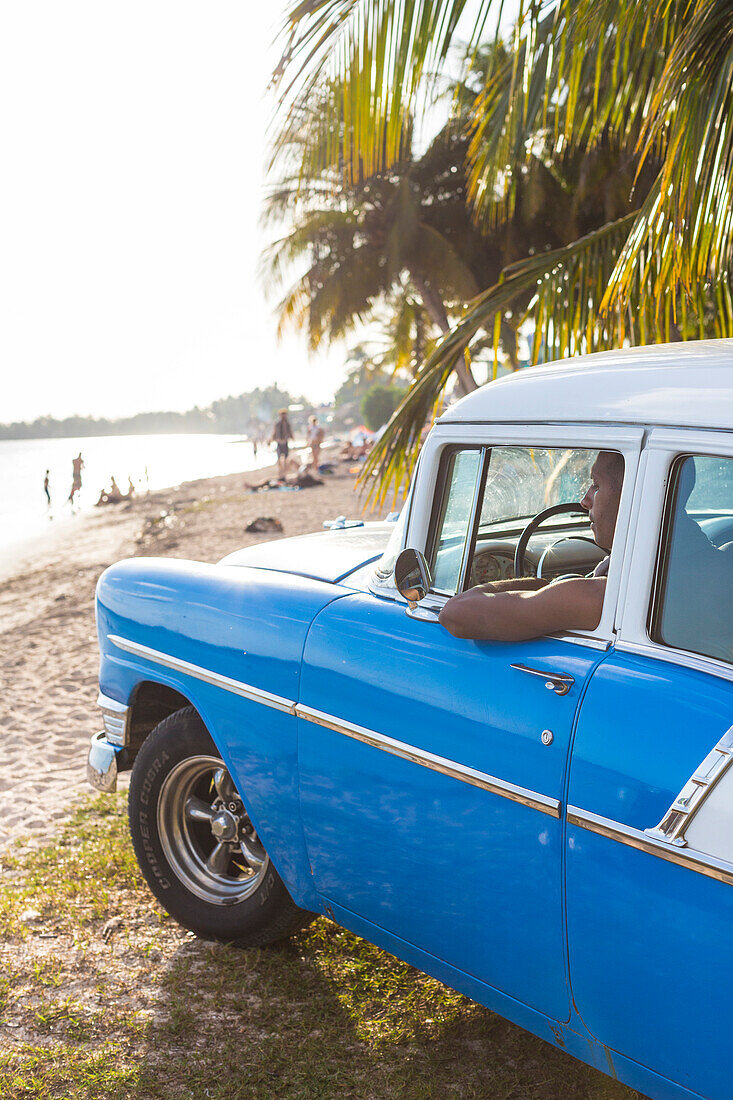 Oldtimer, old car on the beach of Playa Larga, family travel to Cuba, parental leave, holiday, time-out, adventure, Playa Larga, bay of pigs, Cuba, Caribbean island