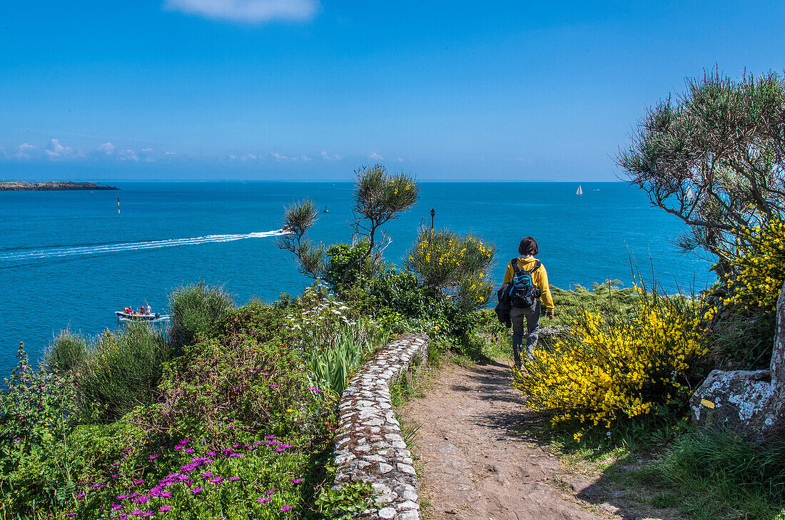 Normandy, Manche, the Grande Ile Chausey, hiker on the littoral path