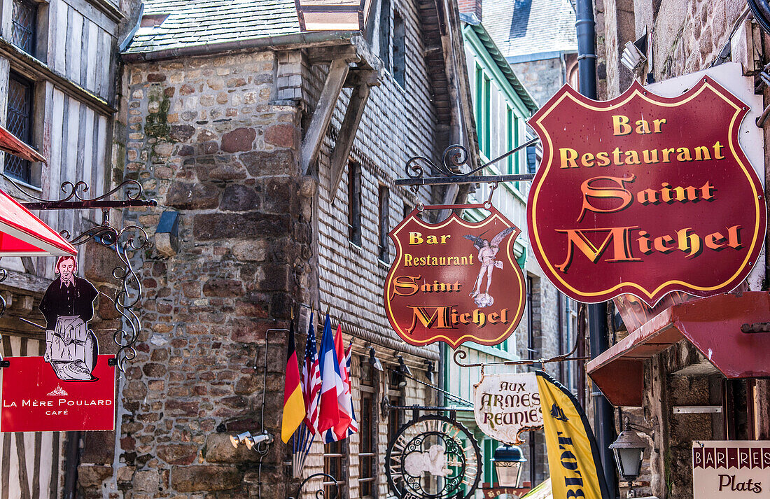 Normandy, Mont Saint Michel, signs in the main street, (UNESCO World Heritage) (on the way to Santiago de Compostela)