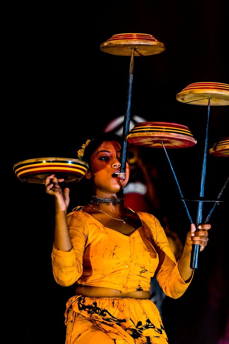 Balancing spinning disks, 'Dances of Sri Lanka' cultural performance, Kandy, Central Province, Sri Lanka
