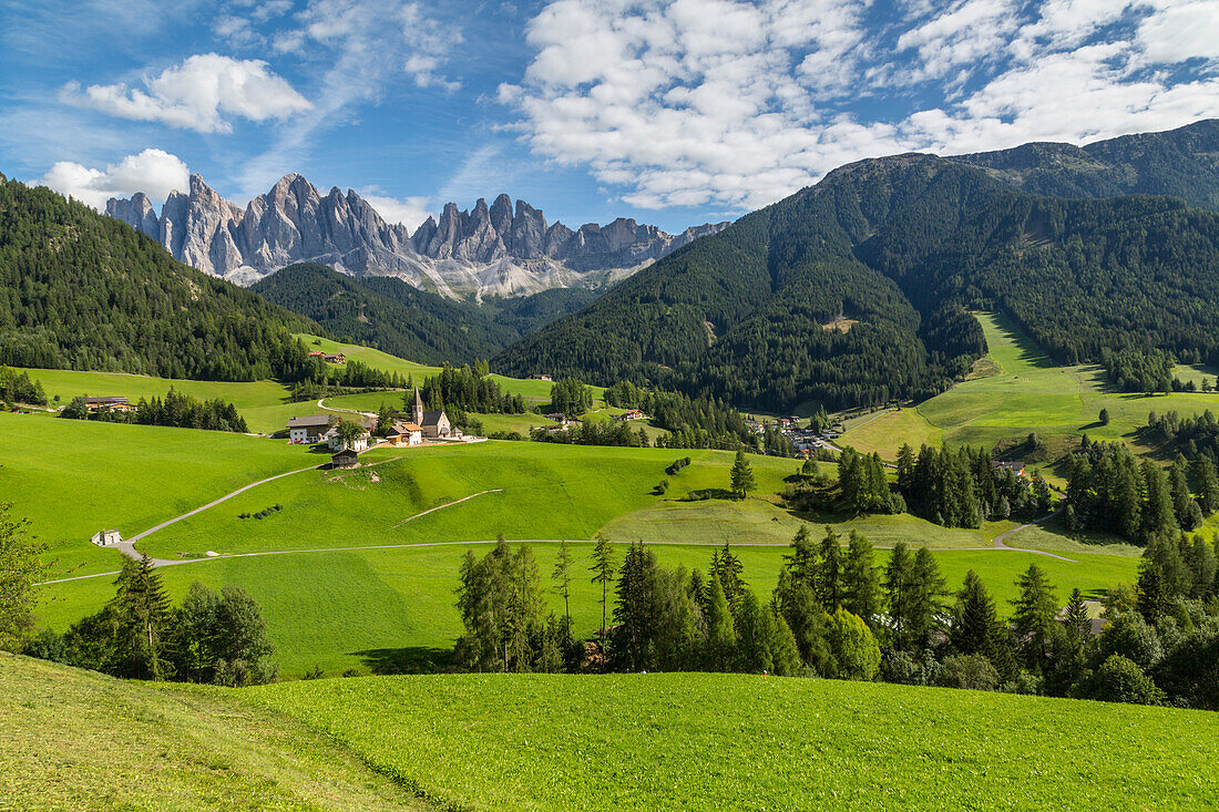 View of Church and mountain backdrop, Val di Funes, Bolzano Province, Trentino-Alto Adige/South Tyrol, Italian Dolomites, Italy, Europe