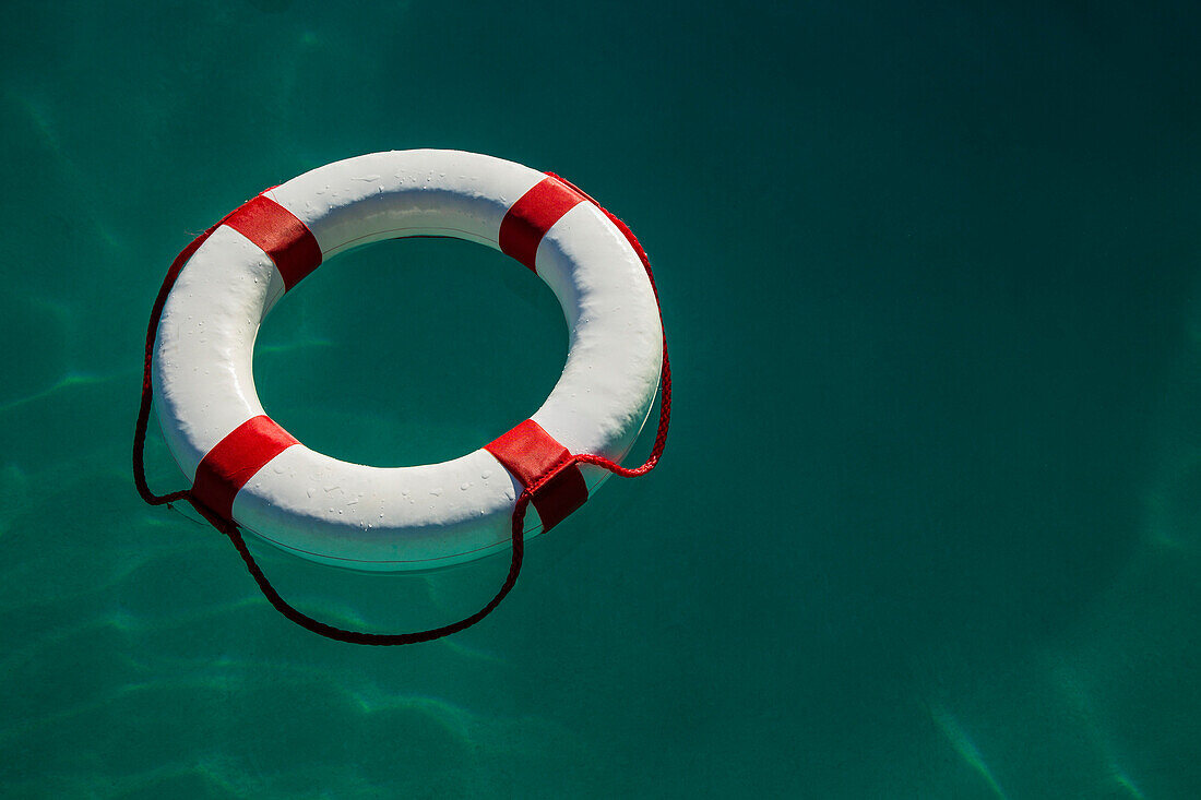 High angle view of white life ring floating on sea